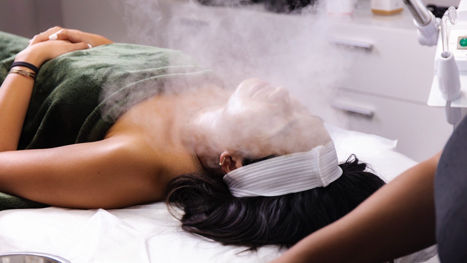 2C8A1490 (2) A woman laying on the bed with steam coming out of her head.